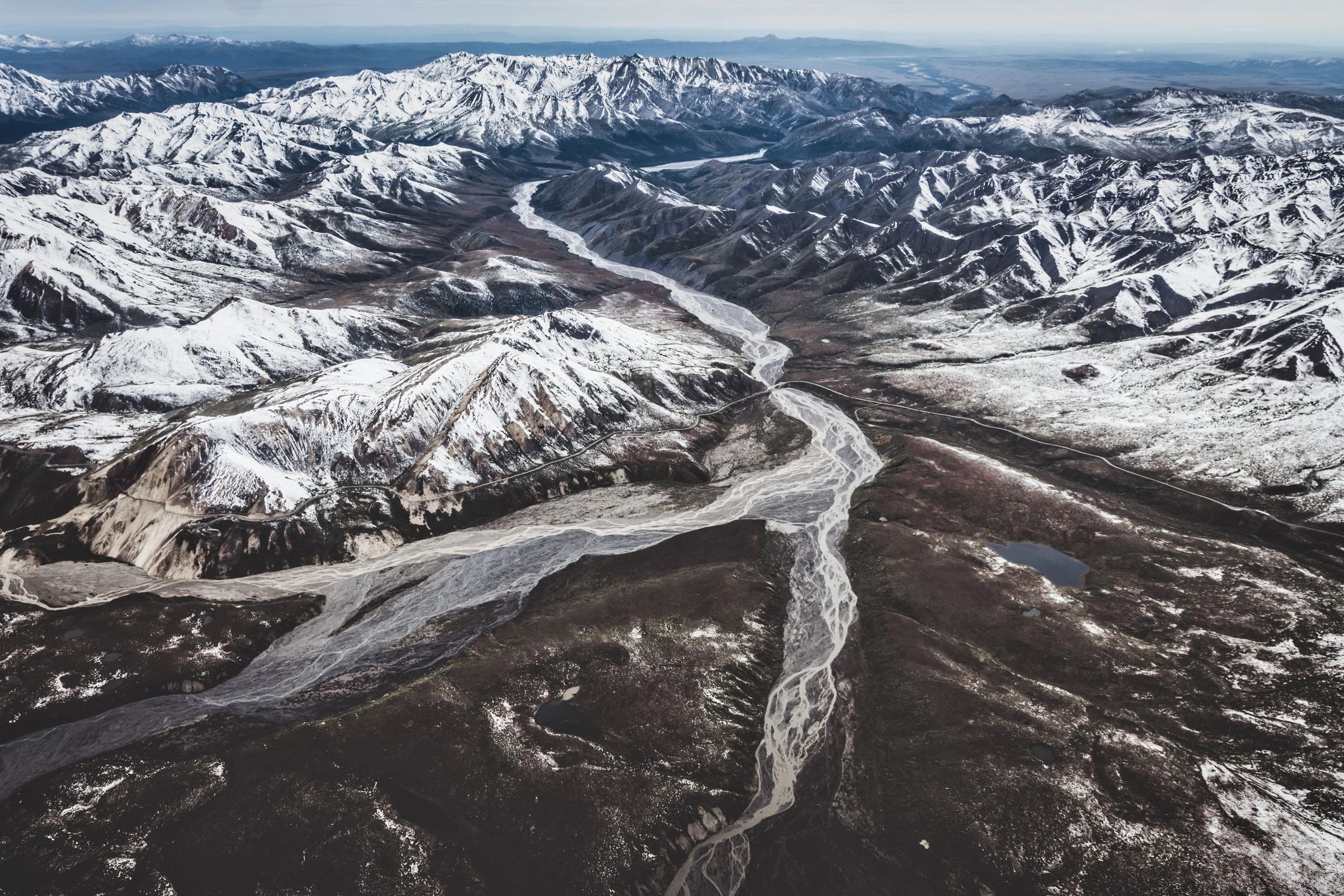 Aerial view of Alaska mountains and braided river